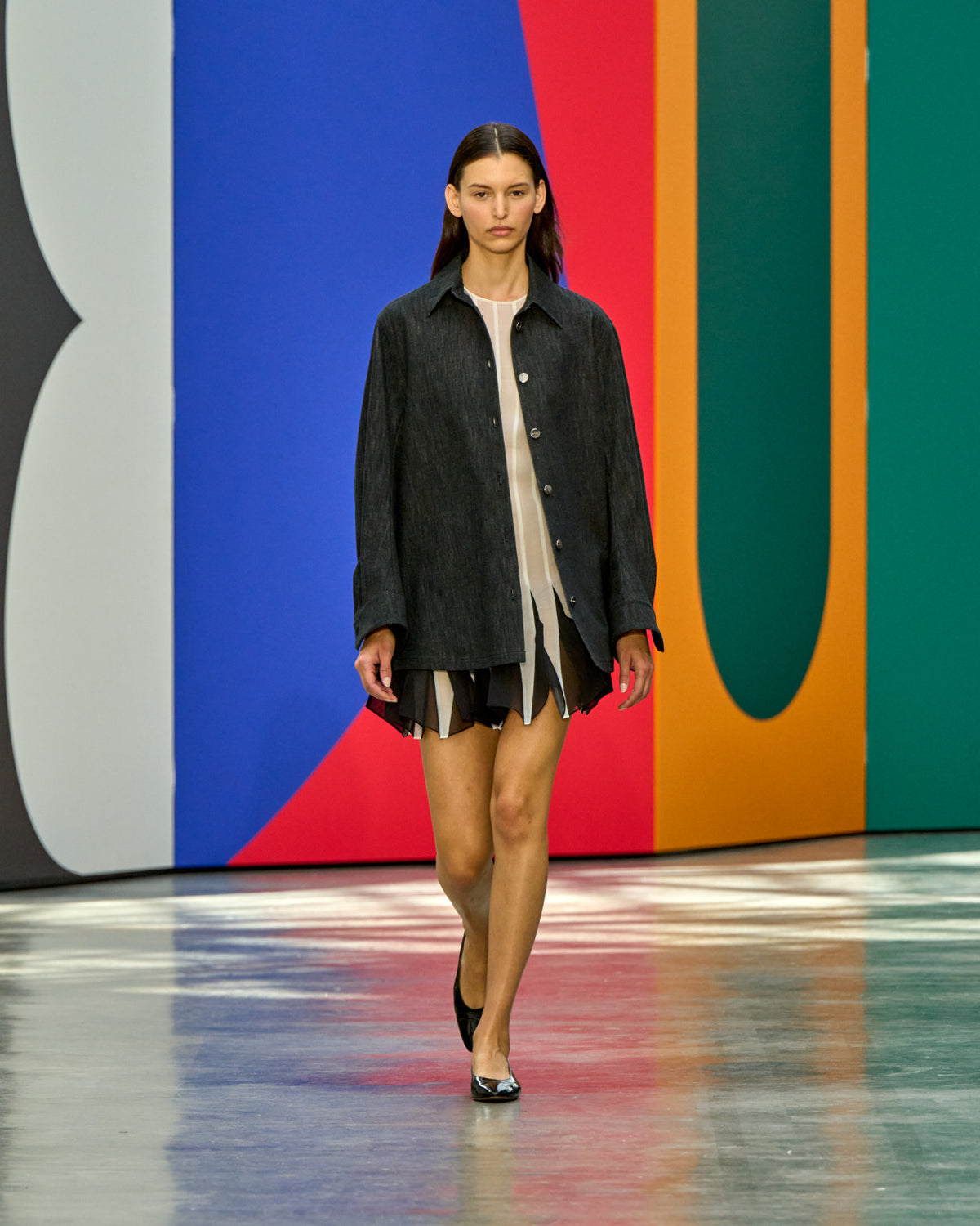 A look from Akris Spring/Summer 2026, blending art and fashion with Swiss luxury design, couture craftsmanship, and timeless elegance inspired by Leon Polk Smith